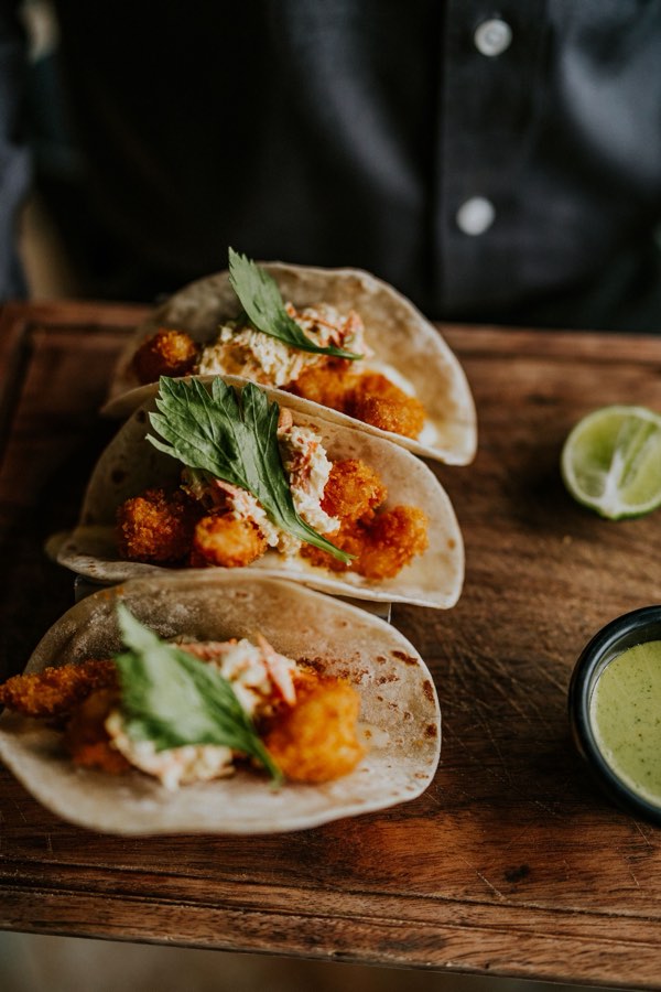 Fish tacos on a board